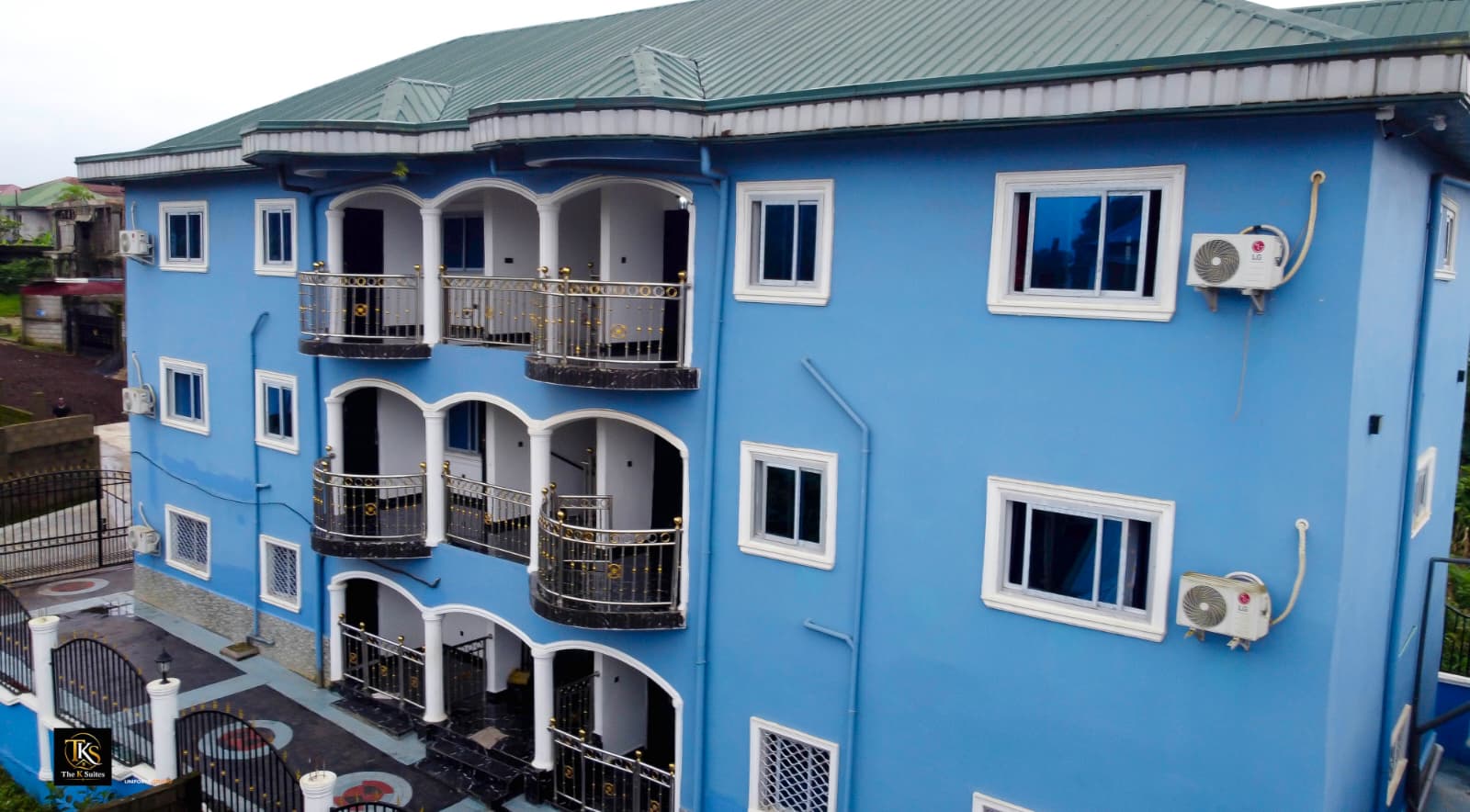 The K Suites — the blue landmark at Mile 17, Buea