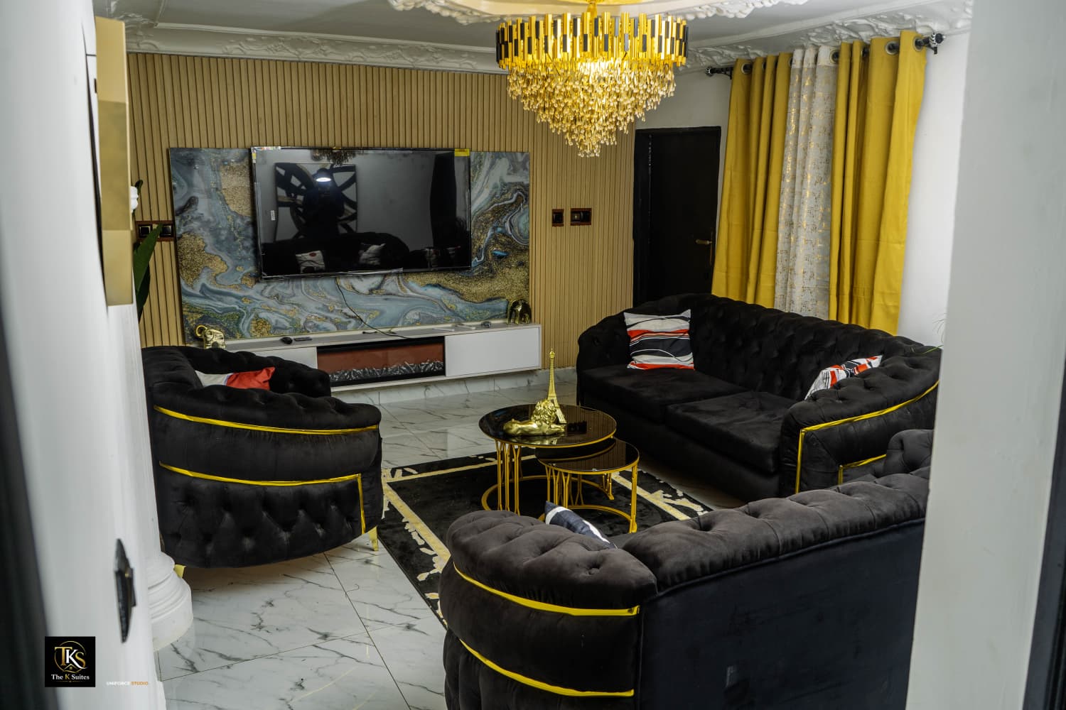 Noir & gold lounge with crystal chandelier